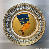 Frontal view of the large wall plate featuring Queen Nefertiti portrait with detailed blue and gold decorative border.