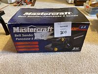 Front of the Mastercraft belt sander box showing brand, product type, sanding belt size, and 3 year warranty