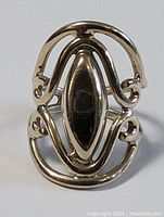 Front-facing view of sterling silver free spirit ring with elongated marquise centerpiece and surrounding swirl detail