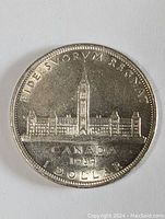 Front side of the coin showing Parliament Buildings and date marked 1939.