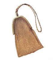 Full view of gold metal mesh purse showing the braided wrist strap and engraved cathedral metal frame with blue stone on the clasp.