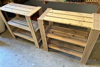 Two identical wooden shelving units side by side on a concrete floor, showing front and top views with three shelving levels each.