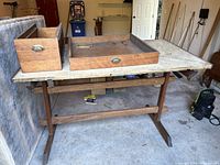 Full view of Victorian oak ships chart or map table with two wooden drawers/containers on top, showing tabletop surface condition and table structure.