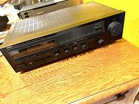 Full angled view of Yamaha RX-330 stereo receiver showing top and front panel with vent grills and control knobs.