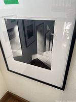 Framed black and white photo with architectural reflections, labeled 29x25 inches