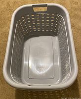 Top-down view of the Sterilite plastic laundry basket showing the rectangular shape, ventilation holes, and built-in handles on the sides.