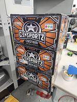 Three stacked boxes of G.I. Sportz Custom Blend paintballs showing the front and side branding and labeling.