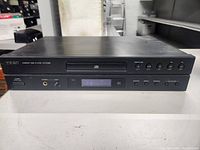 Front view of TEAC CD-P1260 Compact Disc Player showing buttons, headphone jack, and power switch.
