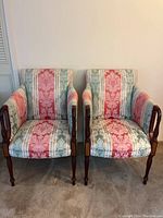 Front view of both chairs showing overall design, upholstery pattern and frame finish