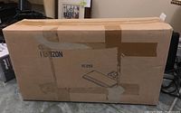 Cardboard box of Horizon articulating keyboard system with taped packaging and Horizon branding printed on it.