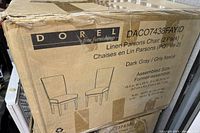 Boxed set of 2 dark gray Linen Parsons Chairs by Dorel furniture, labeled with product details and dimensions.