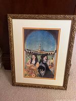 Photo of framed Renaissance-style print featuring a man and woman in period clothing with an architectural backdrop.