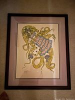 Photo of the framed abstract art print on a floor surface for clarity of the item.