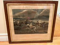 Framed vintage horse print titled 'The First Steeplechase on Record' featuring horses and jockeys racing in a steeplechase.