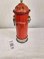Front view of vintage fire hydrant shaped liquor decanter with red paint and chrome accents.