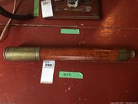 Photo showing the full telescope laid flat with the wood wrapped barrel visible.