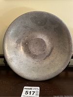 Top-down view showing the hammered texture of the inner surface of the pewter bowl and diameter size.