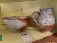 Front view of large bowl and pitcher showing color gradient and crazing detail