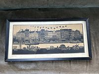 Full framed print showing black and beige woodblock style image of the Nyhavn waterfront with buildings, boats, vehicles, and birds