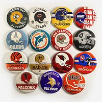 Front view of all 15 vintage NFL football team logo pinback buttons arranged in rows showcasing colorful team logos and helmets.