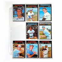 Nine 1971 O-Pee-Chee baseball cards in a plastic binder sleeve displaying players from Expos, Padres, Angels, Brewers, and Twins.