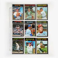 Nine 1971 O-Pee-Chee baseball cards displayed on a single page of a protective binder sleeve.