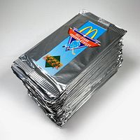 Stack of 34 sealed silver foil trading card packs labeled with McDonald's and Upper Deck logos.