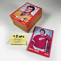 Stack of 83 vintage hockey cards with example cards of Gilles Marotte and Marcel Dionne visible.