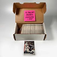 Open white cardboard box filled with a full set of Pro Set 1991 hockey cards numbered 1 to 345, with a visible Wayne Gretzky card in front.