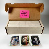 The full set of 700 baseball cards in a cardboard storage box with a sticky note reading '91 U.D. Baseball 1-700'.