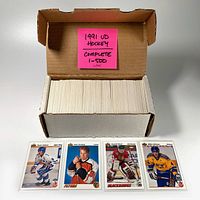 Box of 1991 Upper Deck hockey cards, complete set 1-500 with pink sticky note labeling the set.