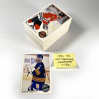 Stack of 1992-93 O-Pee-Chee Premier hockey cards, cards include Dominik Hasek and others, with a note saying the set is complete from 1 to 132