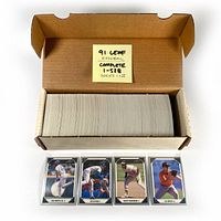 Cardboard box containing the full set of 1991 Leaf baseball cards 1-528 Series I & II. Cards shown stacked neatly inside the box.