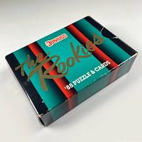 Front angled view of a sealed 1988 Donruss The Rookies baseball card box with teal, black, and red striped design and gold foil text.