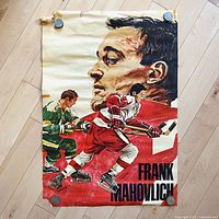 Full view of vintage 1970 Frank Mahovlich Coca-Cola hockey poster depicting a large profile of Frank Mahovlich and two skaters in mid-action, showing overall condition and design.
