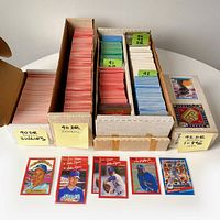 Boxed sets of Donruss baseball cards arranged by year and set, with visible hand-labeled tabs indicating 90 DR Silhouettes, 90 DR Baseball, 91 DR, 92, 93 DR, 94 DR.
