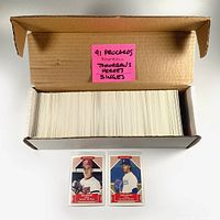 Box of 1991 ProCards Tomorrow's Heroes baseball cards with two sample cards displayed in front: Mike Mussina and Pedro Martinez.