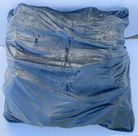 Square gray sensory crash pad with soft, plush exterior cover shown from above.