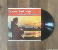 Photo of the Johnny Cash 'Sings Hank Williams' vinyl LP record with cover and record partially showing