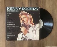 Photo showing the Kenny Rogers Greatest Hits album cover with track list and vinyl record partially pulled out.