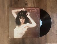 Photo showing the Easter LP vinyl record by Patti Smith Group with album cover and visible black vinyl disc.