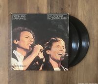 Photo of gatefold vinyl record sleeve partially opened showing the vinyl records inside.