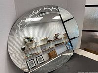 Full view of the round etched mirror illustrating the overall size and decorative edge pattern.