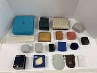 Collection of assorted jewelry gift boxes arranged in two rows on white background