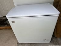 Front view of white Danby Premier chest freezer showing the full unit and power dial.