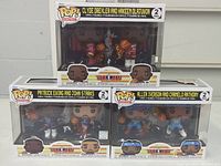 Three unopened Funko Pop NBA JAM basketball figure sets featuring Clyde Drexler and Hakeem Olajuwon, Patrick Ewing and John Starks, Allen Iverson and Carmelo Anthony.