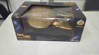 Image showing unopened original box containing the limited edition Starship Enterprise model with wear visible on box and plastic display window.