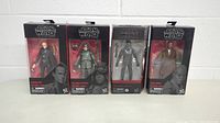 Four Star Wars Black Series figures in original packaging: Dryden Vos, Han Solo (Mimban), Elite Squad Trooper, Mace Windu.