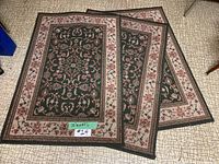 Three matching small entry rugs overlapping on floor, showing full pattern and size label 32x47 inches