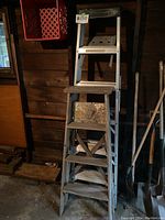 Front view of the Featherlite aluminum step ladder showing six steps and metal construction.